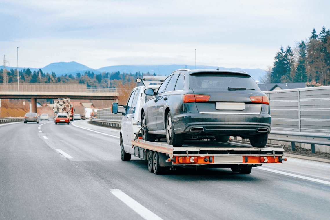 Car on a platform on the road